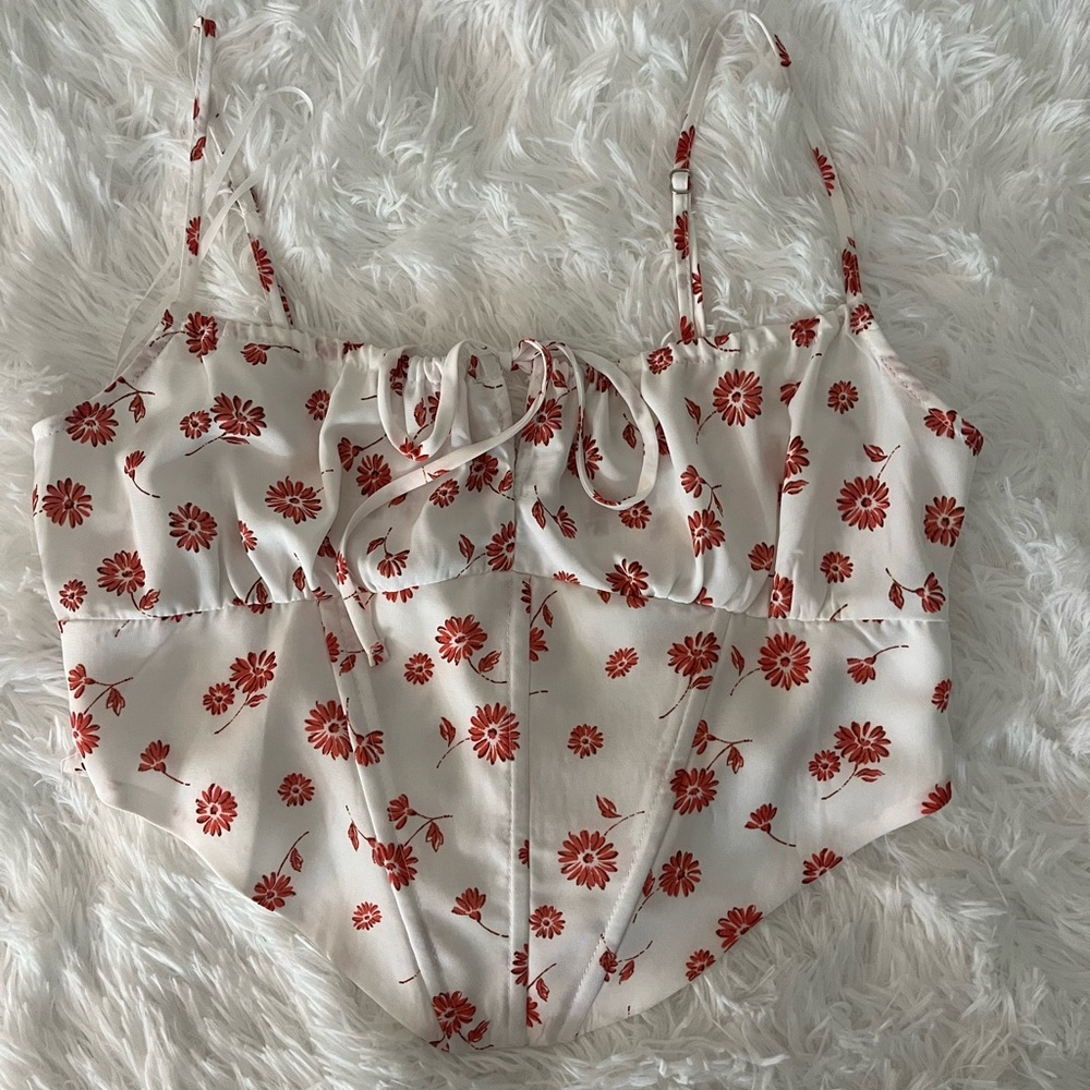 White top with orange flowers